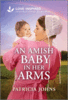 An Amish Baby In Her Arms